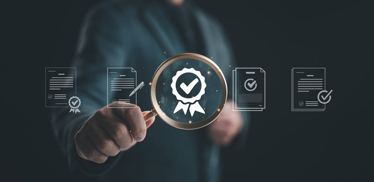 A professional reviewing certification and global accreditation readiness documents.