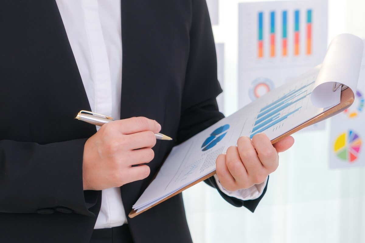 A professional reviewing institutional performance charts and assessment data.